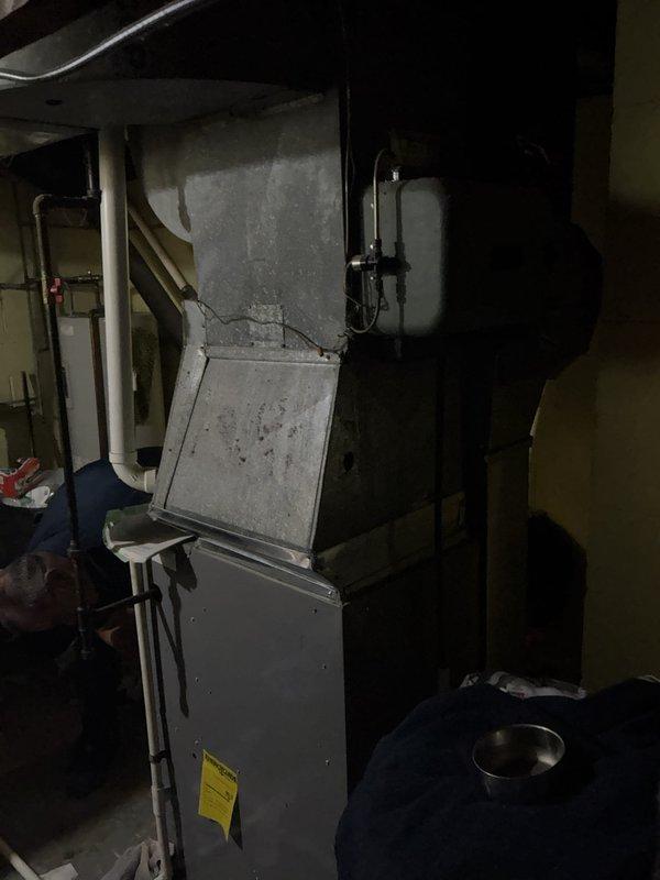 Performed comprehensive HVAC system evaluation on residential air conditioning unit over ten years old experiencing fan motor failure while cooling function remained operational. Assessed existing furnace and air handler configuration in basement mechanical room, documenting current system condition through detailed photography of equipment, ductwork connections, electrical components, and condensate drainage lines. Provided full system replacement estimate options to address aging equipment and failed blower motor component, presenting cost-effective solutions for complete AC system upgrade to restore proper airflow and cooling functionality.