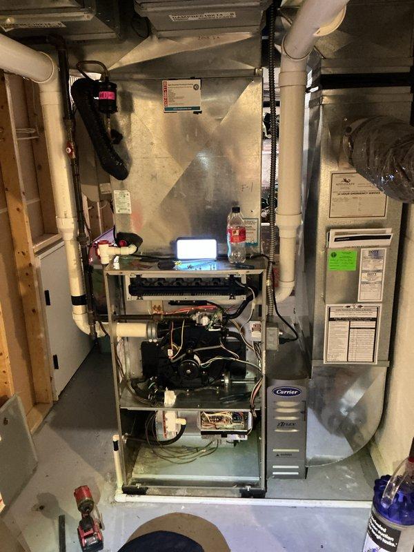 Completed annual HVAC maintenance on Carrier furnace system. Inspected compressor unit, electrical connections, and condensate drainage system; verified all components operating within normal parameters. Documented equipment condition with photos showing proper wire connections, functional compressor mounting, and clear condensate lines.