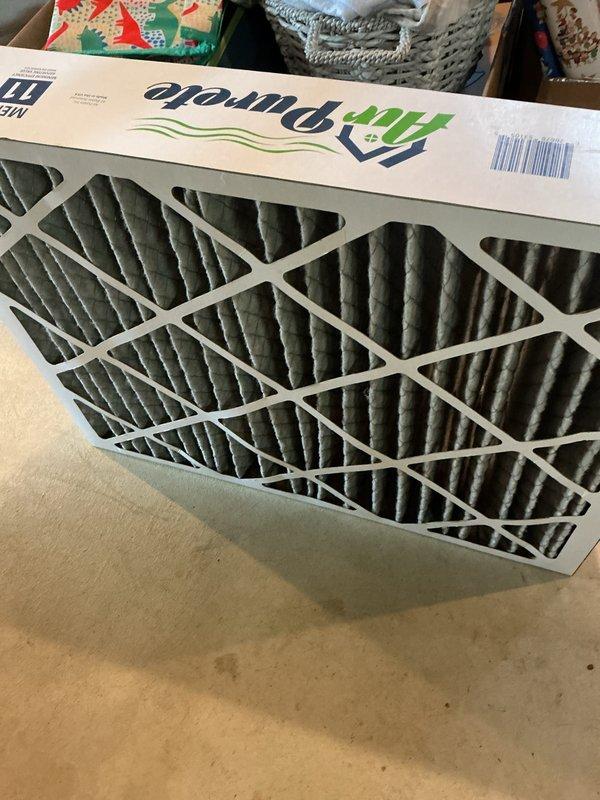 Completed routine AC tune-up on 1-year-old central air conditioning system with no reported issues. Inspected evaporator coil and found moderate dust and debris accumulation on mesh surface; cleaned coil to restore optimal airflow and heat transfer efficiency. Replaced existing air filter with new FilterBuy MERV-rated filter to maintain proper system operation and indoor air quality.