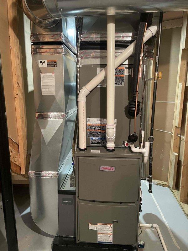 Completed full HVAC system installation including a Lennox 90,000 BTU furnace with humidifier reconnection and a 3-ton rear-discharge air conditioning unit. All ductwork, refrigerant lines, condensate drainage, and electrical connections were installed per code specifications, with permits obtained for mechanical and HVAC work. System was tested, verified operational, and left in excellent working condition.