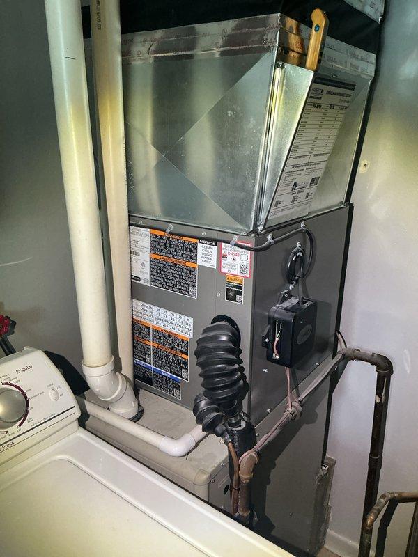 Completed annual cooling maintenance on residential HVAC system. Performed comprehensive inspection of furnace and air handling components, verified all safety labels and operational specifications were intact, and inspected condensate drain lines and PVC venting for proper function. System found in good operating condition with all mechanical components functioning within manufacturer specifications.