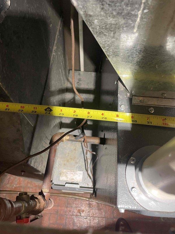 Responded to service call for 15-year-old central air conditioning system experiencing inadequate cooling with temperature differentials of 3-6 degrees from setpoint. Performed comprehensive system evaluation and measurements of existing equipment and ductwork clearances in mechanical space. Based on assessment findings and system age, provided full system replacement estimate to address cooling deficiency and improve overall performance and efficiency.