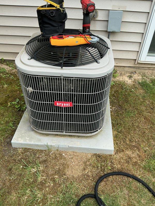 Completed routine spring tune-up and preventative maintenance on Bryant brand central air conditioning system. Performed comprehensive inspection of outdoor condenser unit, tested system performance with digital gauges, verified electrical connections at disconnect box, and assessed overall unit operation. System found to be functioning properly with no issues identified during service call.