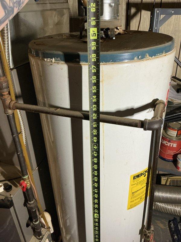 Responded to service call for leaking condensation pump on 5-year-old furnace system located in basement. Upon arrival, inspected HVAC equipment and associated plumbing components including water heater, ductwork, and drainage systems. Identified condensation pump failure as source of water leak. Documented equipment condition and surrounding infrastructure with photographs showing copper piping, galvanized ductwork, and utility connections. System is not covered under parts or labor warranty.