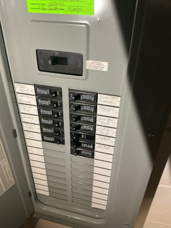 Conducted electrical assessment for Level 2 EV charger installation at a single-family residence originally constructed in 1949 with electrical panel upgraded in 2012. Inspected existing 200-amp main service panel, documented current circuit breaker configuration and available capacity, and photographed panel interior to evaluate feasibility for dedicated 240-volt charging circuit installation. Determined panel has adequate space and capacity to accommodate new EV charger circuit with proper wire sizing and GFCI protection per current NEC requirements.