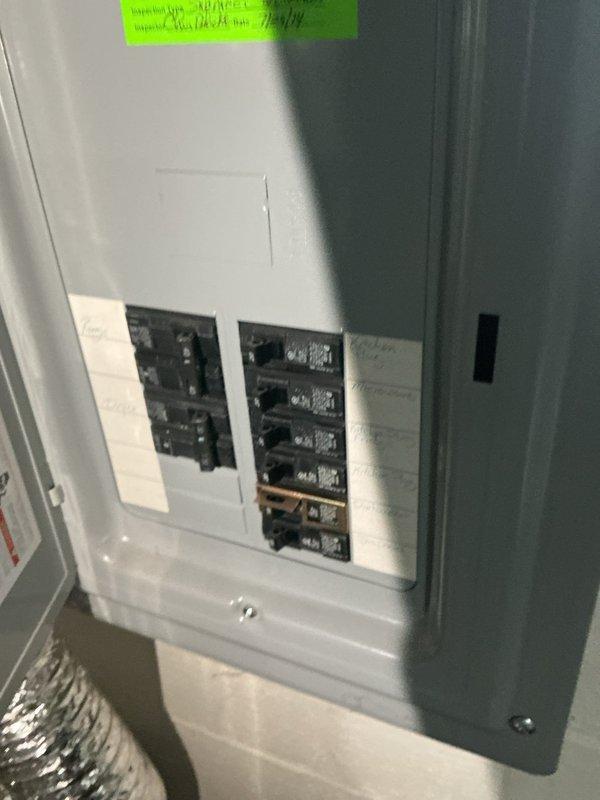 Conducted electrical assessment for Level 2 EV charger installation at a single-family residence originally constructed in 1949 with electrical panel upgraded in 2012. Inspected existing 200-amp main service panel, documented current circuit breaker configuration and available capacity, and photographed panel interior to evaluate feasibility for dedicated 240-volt charging circuit installation. Determined panel has adequate space and capacity to accommodate new EV charger circuit with proper wire sizing and GFCI protection per current NEC requirements.