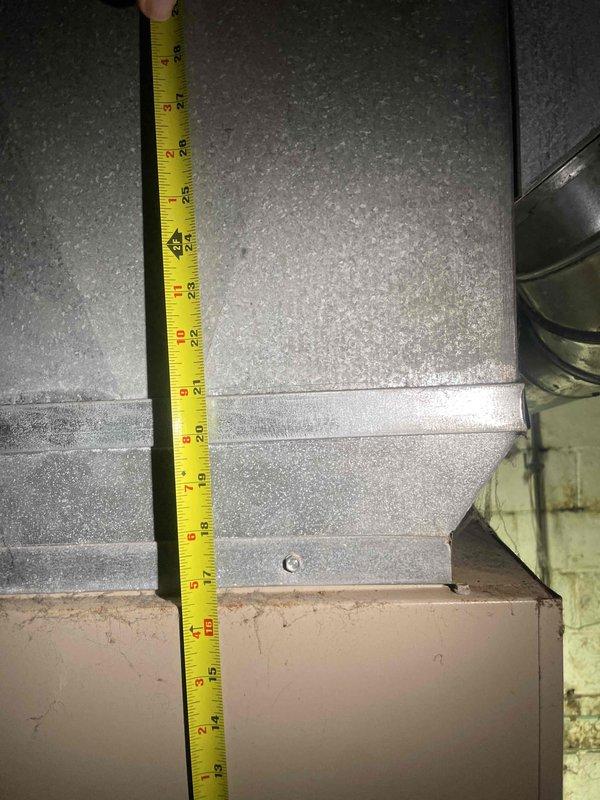 Responded to non-operational air conditioning system with aging HVAC equipment requiring full system replacement. Conducted comprehensive assessment of existing outdoor AC unit and basement furnace installation to determine replacement specifications. Performed detailed measurements of existing ductwork clearances and equipment dimensions to ensure proper sizing and fitment for new system installation. Provided estimate for complete HVAC system replacement affecting whole house comfort control.