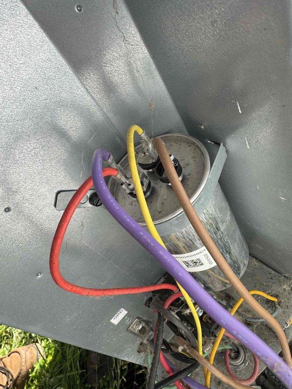 Responded to no cooling complaint on residential mobile home air conditioning system. Upon inspection, found failed dual run capacitor preventing compressor and condenser fan operation. Removed defective capacitor, installed new replacement capacitor with proper microfarad ratings for both compressor and fan motor. Verified all electrical connections at contactor and capacitor terminals were secure. Started system and confirmed compressor and outdoor fan motor operation, proper amp draw on both components, and return to normal cooling cycle. System restored to full operational status.