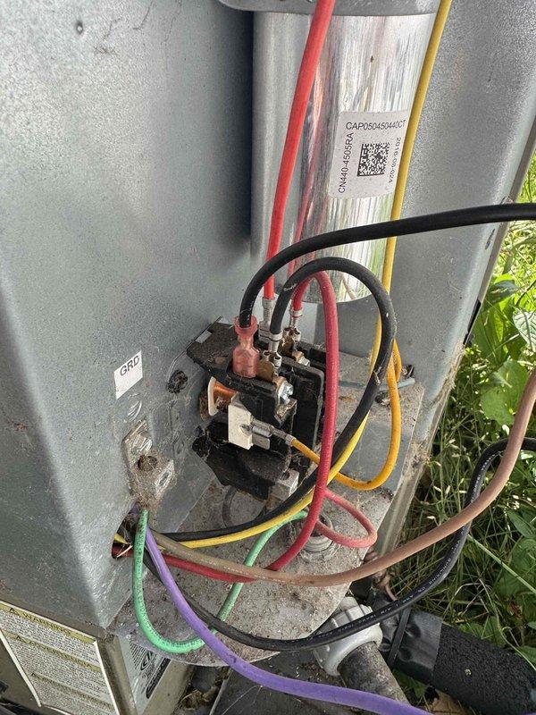 Responded to no cooling complaint on residential mobile home air conditioning system. Upon inspection, found failed dual run capacitor preventing compressor and condenser fan operation. Removed defective capacitor, installed new replacement capacitor with proper microfarad ratings for both compressor and fan motor. Verified all electrical connections at contactor and capacitor terminals were secure. Started system and confirmed compressor and outdoor fan motor operation, proper amp draw on both components, and return to normal cooling cycle. System restored to full operational status.