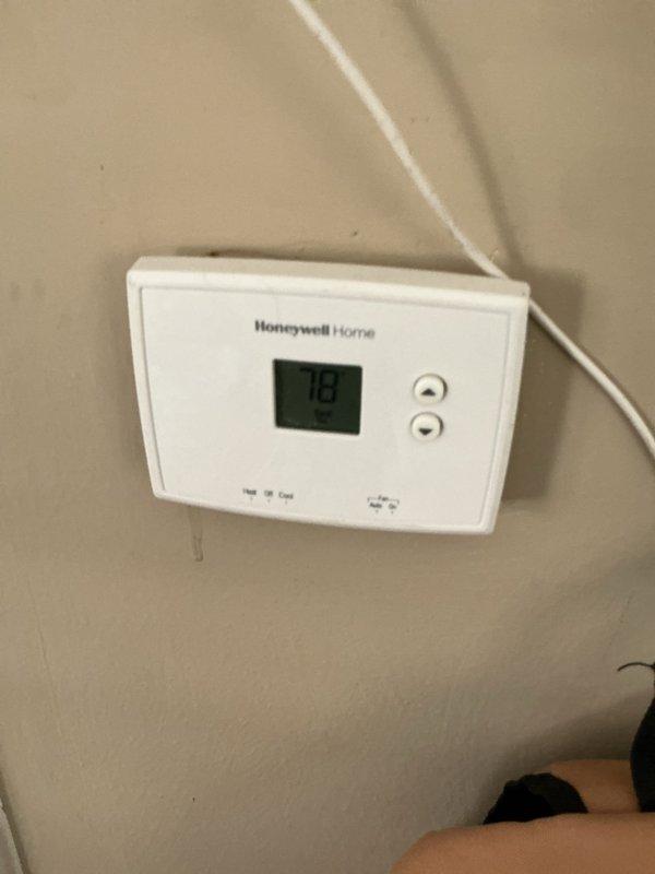 Responded to no cooling call on brand new central air conditioning system. Upon arrival, verified thermostat display showing 78°F and checked system operation. Inspected outdoor disconnect box and found proper electrical connections at terminal blocks with all wiring intact. Diagnosed issue as outdoor unit not receiving power due to disconnect being in off position. Switched disconnect handle to on position, restoring power to condensing unit. Verified system startup and proper operation with unit cycling normally. Confirmed cooling mode engaged and system functioning as designed.