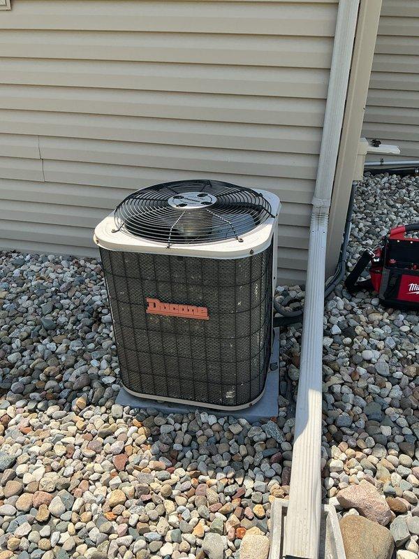 Responded to no cooling call on 20-year-old Ducane central air conditioning system with non-operational condenser fan motor. Upon arrival, confirmed outdoor unit was completely non-functional with fan motor seized and not spinning. Diagnosed failed condenser fan motor and assessed overall system condition given age of equipment. Discussed repair versus replacement options with customer, noting the unit had exceeded its expected service life and additional component failures were likely. Customer elected to consider replacement options due to age and cost of repairs on aging system.