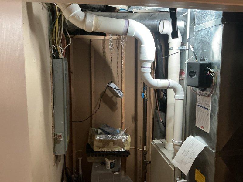 Completed installation of 3-ton air conditioning system with evaporator coil on left side of existing furnace. Established all mechanical and electrical connections, integrated new coil with current ductwork, and reconnected refrigerant lines. Installed condensate drainage system using PVC piping, secured all components per manufacturer specifications, and verified proper system operation upon startup.