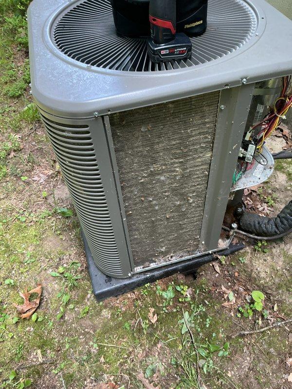 Completed annual cooling maintenance on outdoor condensing unit. Inspected and cleaned condenser coils which showed accumulation of dirt, debris, and environmental buildup on cooling fins and exterior surfaces. Checked refrigerant lines, electrical connections, and control board for proper operation. Verified fan motor operation and reset button functionality. Replaced air filter per maintenance protocol. Unit operating within normal parameters upon completion of service.