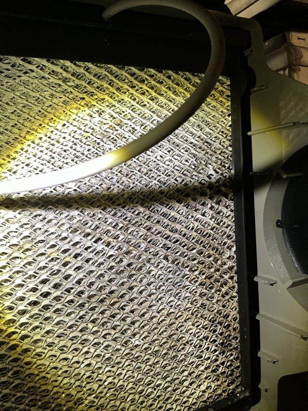 Completed annual cooling maintenance on Lennox HVAC system. Inspected evaporator coil assembly and refrigerant lines, verified heat exchanger fins are clean and in proper working condition, and documented system components including furnace unit and ductwork connections for maintenance records.
