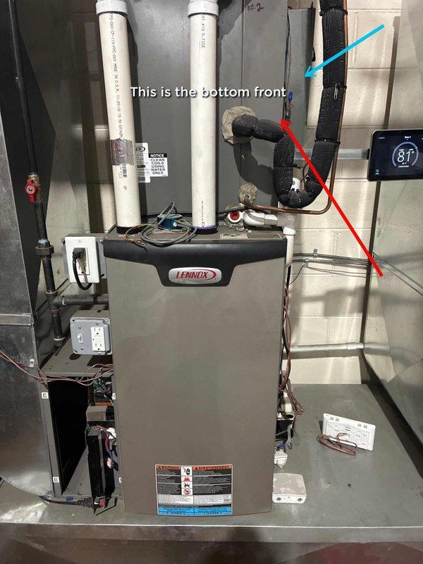 Completed comprehensive site inspection of residential Lennox furnace system and associated ductwork in basement utility area. Documented existing HVAC installation including intake and exhaust venting configuration, insulated refrigerant lines, and digital thermostat control displaying operational temperature readings. Identified section of metal ductwork requiring replacement from decline point downward on left side as indicated. Photographed current system layout showing furnace positioning, PVC vent pipes, electrical connections, and junction boxes for service records and future reference.