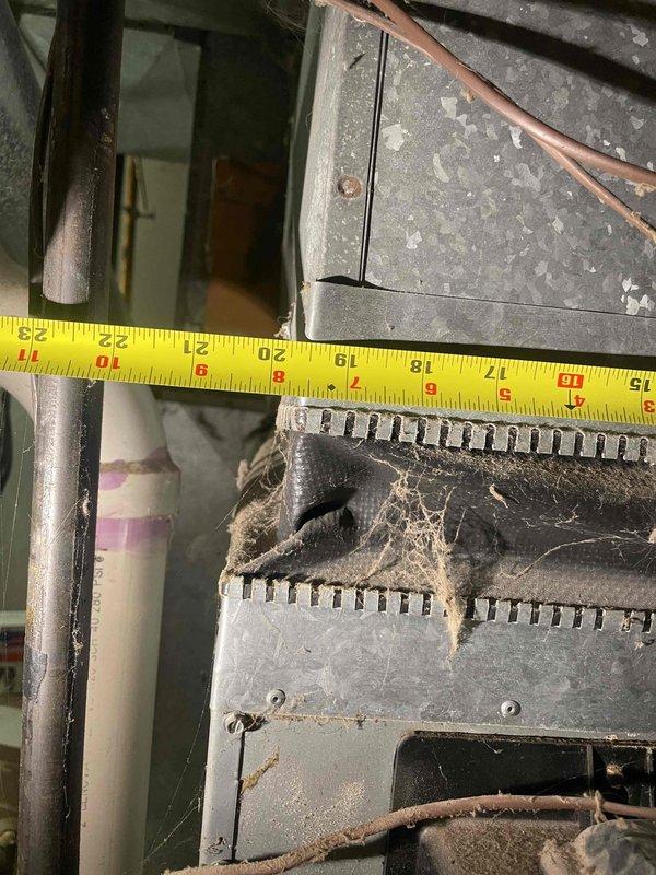 Conducted comprehensive evaluation of residential air conditioning system experiencing complete cooling failure affecting entire home. Compressor failure was confirmed after relay replacement attempt proved unsuccessful in resolving the issue. Performed detailed measurements and photographic documentation of aged HVAC equipment showing significant wear, heavy dust accumulation, and deteriorated components including heat exchanger with substantial debris buildup. Provided complete system replacement estimate due to advanced age of equipment and extent of component failure making repair economically unfeasible.