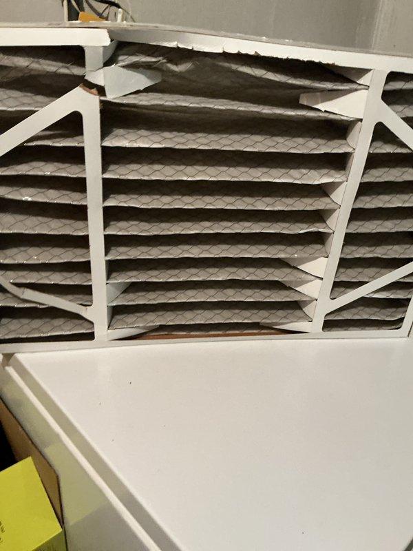 Performed comprehensive cooling system tune-up on residential HVAC unit. Inspected and evaluated air filtration system, noting accumulated dust and debris on pleated filters with diamond pattern mesh. Completed standard maintenance procedures including system performance verification, with all components operating within normal parameters and no deficiencies identified.