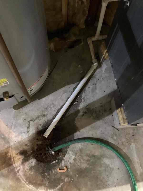 Successfully installed a new 2.5-ton air conditioning system with evaporator coil in basement utility area, with left-side placement configuration and reconnection to existing ductwork and drainage systems. All mechanical permits were obtained prior to installation, and unit was properly connected to furnace/air handler with appropriate refrigerant lines, condensate drainage via white PVC piping, and electrical connections completed per code requirements. Installation included integration with existing HVAC infrastructure, proper mounting and securing of equipment, and verification of all system connections for optimal operation.