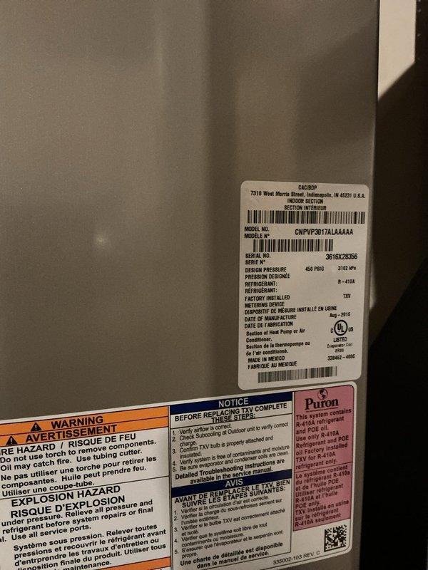 Completed annual HVAC maintenance on residential air conditioning unit. Performed system inspection, checked refrigerant pressures using manifold gauges, verified R-410A charge levels, and documented equipment specifications including model CNPVP3017ALAAAAA. Unit operating within normal parameters with all safety labels intact and legible.