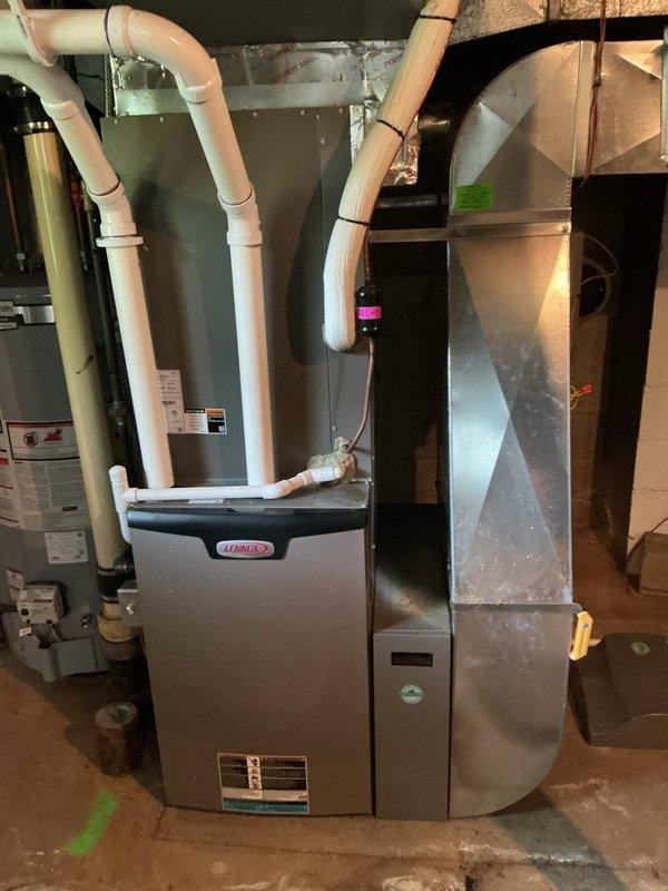Completed deferred air conditioning maintenance on Lennox HVAC system as part of ComfortShield maintenance agreement. Previous winter weather conditions prevented AC service completion in December, requiring rescheduled visit to perform coil inspection and system evaluation. Inspected evaporator coil assembly, noting moderate dust and particulate accumulation on mesh filter surface. Assessed condensate drain line routing and verified proper connection. Evaluated overall system condition including air handler and associated ductwork. System components showed normal operational wear consistent with seasonal use. All AC-specific maintenance tasks completed successfully, bringing system into full compliance with maintenance schedule requirements.