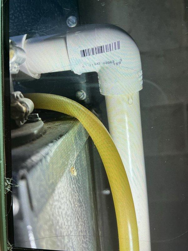 Responded to water leak issue at furnace location. Upon inspection, discovered condensate drainage system blockage preventing water from reaching the condensate pump despite pump operating normally. Identified corroded metal components and compromised PVC condensate drain connections causing water accumulation beneath unit. Cleared blockage in condensate line, verified proper drainage flow to pump, and confirmed system returned to normal heating/cooling operation with no further leakage.