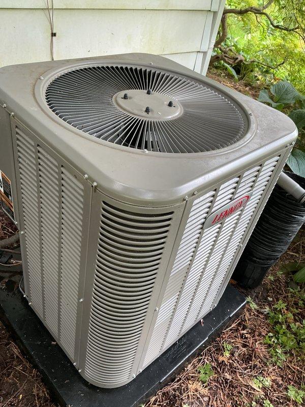 Completed routine preventative maintenance on Bryant residential air conditioning system. Performed comprehensive inspection of outdoor condenser unit, verified proper airflow through louvered panels and top grille assembly, checked electrical connections and refrigerant lines, and documented equipment condition with photos. Unit operating within normal parameters with adequate clearance from surrounding vegetation maintained for optimal performance.