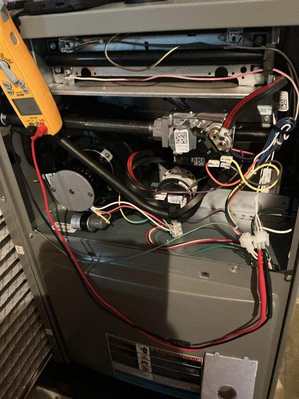 Completed comprehensive 5-year ComfortGuard maintenance visit on residential HVAC furnace system. Performed thorough inspection of internal components including gas valve assembly, blower motor, heat exchanger, and burner assembly with access panel removed for full system evaluation. Conducted electrical testing and diagnostics using specialized metering equipment to verify proper voltage and amp draw across all connections. Inspected and verified integrity of all wire connections including safety circuits and control wiring. Confirmed proper operation of blower motor and assessed condition of mechanical components. Supplied and staged replacement air filters with pleated media for customer installation. All systems tested and operating within manufacturer specifications upon completion of maintenance protocol.