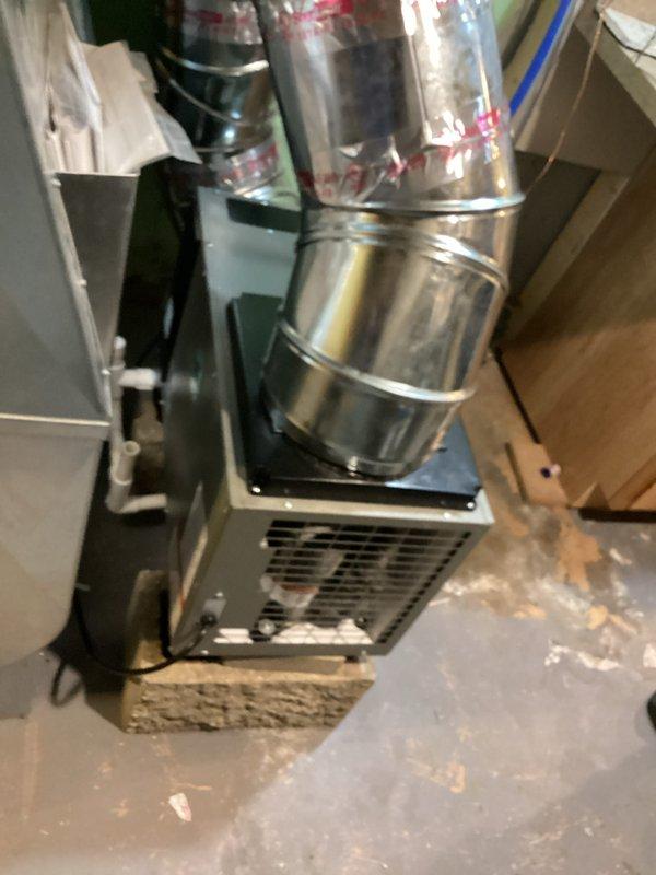 Successfully installed whole-home dehumidifier system in basement utility area, integrating unit with existing HVAC infrastructure. Connected dehumidifier to main air handler via metallic ductwork transitions, ensuring proper airflow distribution throughout the system. Completed all electrical connections, mounted control panel, secured ductwork with appropriate sealing, and verified operational functionality of the installed indoor air quality equipment.