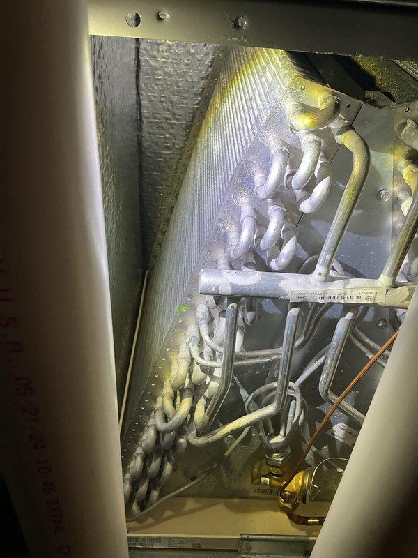 Completed scheduled Air Care Cooling maintenance on residential split system. Performed comprehensive inspection of outdoor condenser unit and indoor evaporator coil assembly. Exterior condenser cabinet showed heavy accumulation of dirt, dust, and organic debris requiring attention. Verified evaporator coil condition, refrigerant line connections, and drainage system operation. All components functioning within normal parameters. System operational upon completion of routine maintenance protocol.