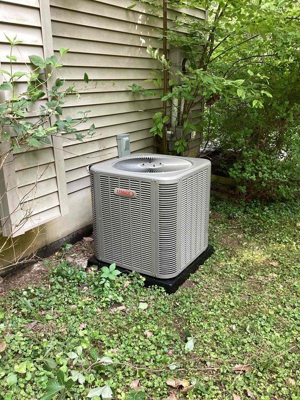 Completed full HVAC system installation including a 70,000 BTU furnace, 2.5 ton air conditioning condenser unit, and evaporator coil. The Lennox condenser was positioned on a base pad at the rear exterior of the residence with proper electrical disconnect and refrigerant line connections. All mechanical components were installed per manufacturer specifications and local code requirements, with permits obtained prior to installation.