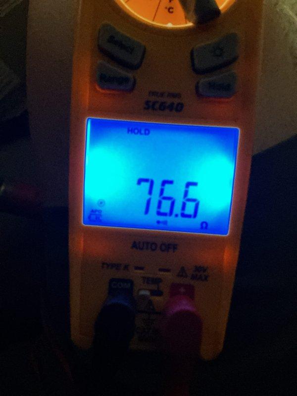 Performed scheduled air handler maintenance on residential gas furnace system. Accessed interior cabinet to inspect blower motor assembly, gas valve components, electrical connections, and associated wiring. Verified proper operation of all mechanical and electrical systems within the unit. Conducted temperature measurements using digital meter, recording operational readings at 76.6°F to confirm system performance parameters. Replaced air filter and evaporator pad as part of routine maintenance protocol. All components found in satisfactory working condition with normal wear patterns consistent with regular operation.