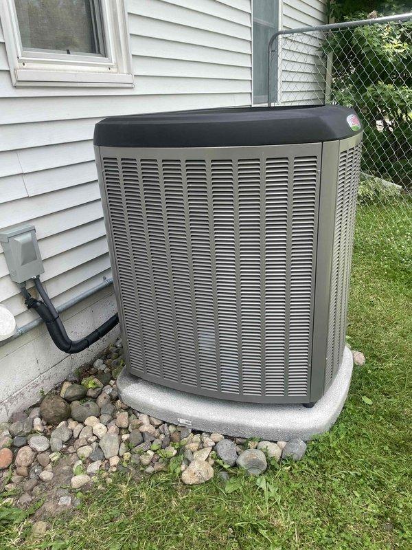 Completed installation of Lennox air conditioning system with new evaporator coil at residential property. Unit positioned on concrete pad on left side of structure with proper clearance from exterior wall and adequate service access. Connected refrigerant lines, electrical conduit, and condensate drain per manufacturer specifications. Performed system startup, verified proper refrigerant charge, tested all electrical connections, and confirmed operational parameters within normal range. System operating efficiently with no issues detected upon final inspection.