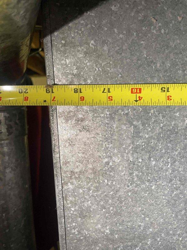 Conducted site assessment for new central air conditioning system installation at residential property with no existing AC unit. Evaluated mechanical room and utility space to determine equipment placement and clearance requirements. Measured available space within existing ductwork and utility area to verify proper sizing and fitment for new condensing unit and air handler. Documented measurements of sheet metal ductwork openings and clearances around existing water heater and plumbing infrastructure. Assessed copper line routing paths and electrical wiring locations to plan refrigerant line set installation. Photographed confined space dimensions and equipment positioning to prepare accurate equipment specifications and installation plan. Provided customer with financing information as requested for complete system replacement.