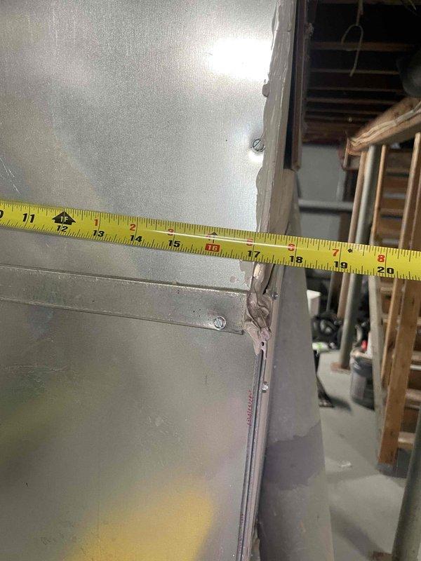 Conducted on-site evaluation for complete air conditioning system replacement. Assessed existing HVAC infrastructure including ductwork dimensions, furnace clearances, and equipment placement in basement utility area. Documented measurements and spatial requirements for new AC installation scheduled within next month, with existing furnace approximately five years old and in serviceable condition.