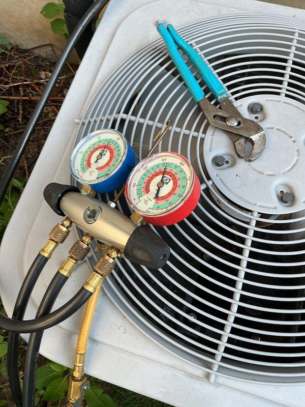 Completed routine maintenance inspection on a 5-year-old central air conditioning system. Connected manifold gauge set to measure refrigerant pressures and verified system operating parameters were within normal range. Inspected outdoor condenser unit, refrigerant lines, and all accessible components. System found to be operating properly with no issues identified or repairs required at this time.