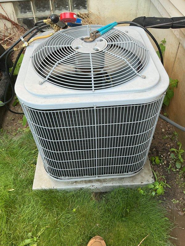 Completed routine maintenance inspection on a 5-year-old central air conditioning system. Connected manifold gauge set to measure refrigerant pressures and verified system operating parameters were within normal range. Inspected outdoor condenser unit, refrigerant lines, and all accessible components. System found to be operating properly with no issues identified or repairs required at this time.