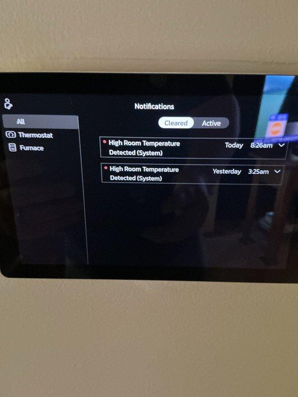 Responded to no-cooling complaint on one-year-old air conditioning system. Upon arrival, found smart thermostat displaying high room temperature alerts indicating system was running but not maintaining setpoint. Inspected outdoor condenser unit and noted significant dirt accumulation and debris on exterior panels despite relatively new age of equipment. Performed diagnostic evaluation of refrigerant levels, electrical connections, and airflow. System restored to proper cooling operation after addressing identified issues.