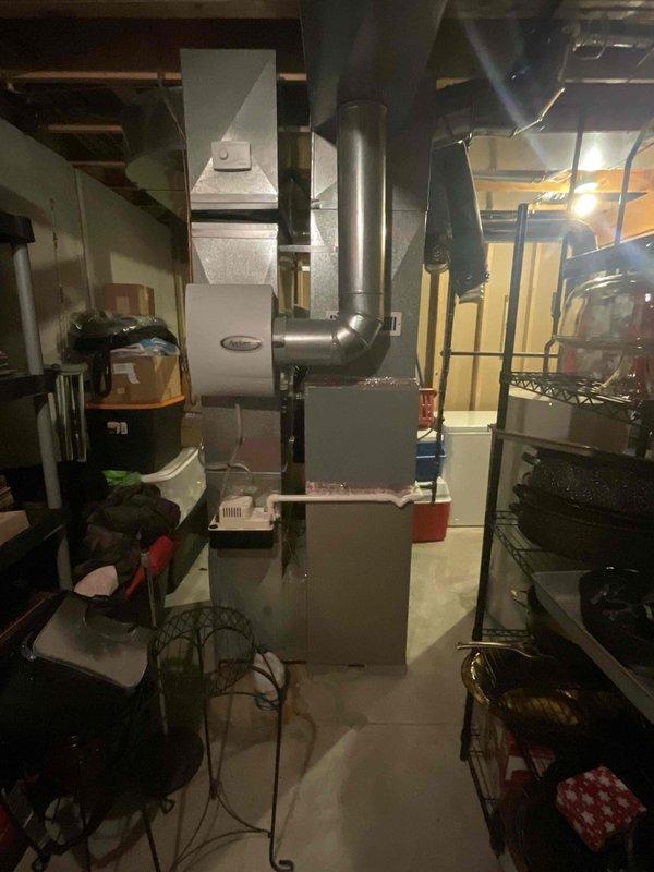 Completed comprehensive assessment of 14-year-old basement furnace system currently functioning below optimal efficiency levels. Documented existing equipment configuration including main heating unit, ductwork connections, and installation layout to prepare detailed estimate for full HVAC system replacement. Evaluated current unit placement, accessibility for future installation, and surrounding utility space constraints to ensure seamless transition to new high-efficiency equipment.