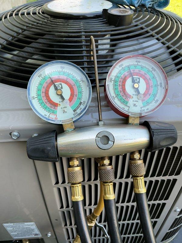 Performed annual HVAC maintenance on Goodman packaged unit model CMPV36R11A1AAAAA. Connected manifold gauge set to measure refrigerant pressures and verified system operating parameters within manufacturer specifications for R-410A refrigerant. Completed routine inspection and system diagnostics on outdoor condensing unit.
