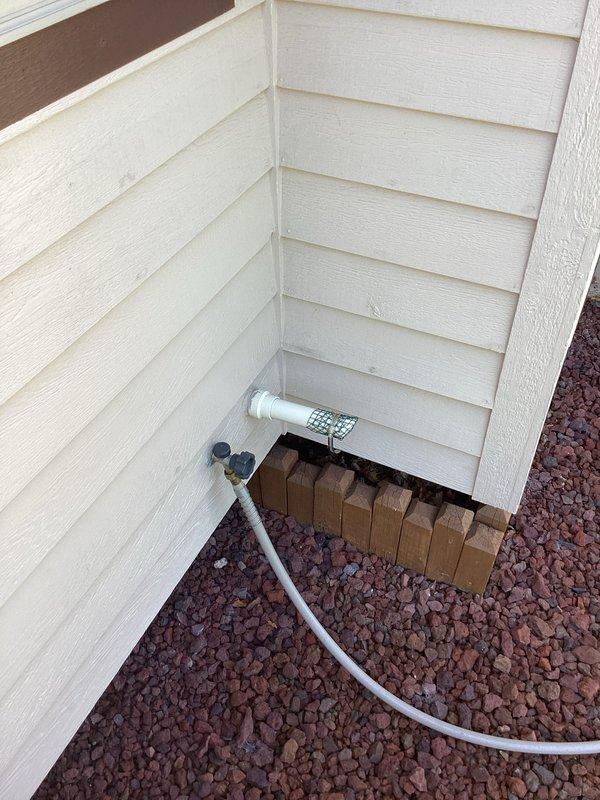Completed installation of 2-ton Lennox air conditioning system with matching evaporator coil. Unit positioned on concrete pad with proper clearances, secured refrigerant line connections, installed condensate drainage with PVC piping, and verified all electrical connections. System tested and operational with proper airflow and refrigerant charge confirmed.