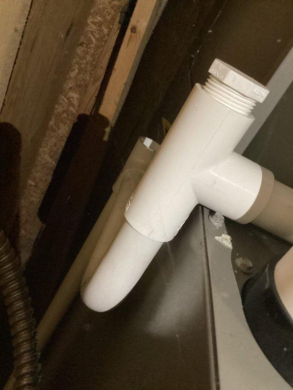 Completed routine AC tune-up and furnace maintenance on residential HVAC system. Performed standard inspection of Lennox thermostat, verified proper operation and programming with system set to cooling mode and scheduled temperature setpoints. Inspected condensate drain assembly and PVC trap configuration for proper drainage and function, confirmed all plumbing connections secure with no visible leaks or blockages.