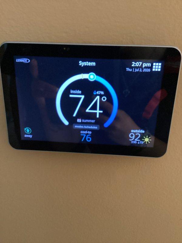 Completed routine AC tune-up and furnace maintenance on residential HVAC system. Performed standard inspection of Lennox thermostat, verified proper operation and programming with system set to cooling mode and scheduled temperature setpoints. Inspected condensate drain assembly and PVC trap configuration for proper drainage and function, confirmed all plumbing connections secure with no visible leaks or blockages.