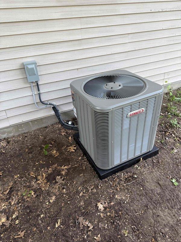 Completed installation of 2.5-ton Lennox air conditioning system with matching evaporator coil at rear of residence. Installed new outdoor condensing unit on pad, ran refrigerant lines through exterior wall, mounted electrical disconnect box, and established new dedicated electrical circuit per permit requirements. System tested and operational upon completion.