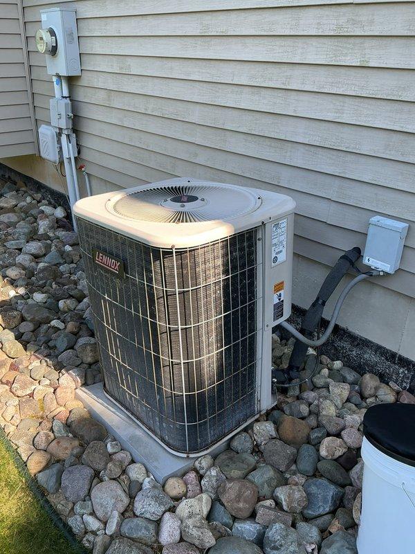 Responded to complaint of weak airflow throughout the home with older Lennox heat pump system and newly installed furnace. Upon inspection, found inadequate airflow at supply registers despite unit operating. Performed comprehensive system evaluation including inspection of outdoor unit, indoor blower assembly, ductwork connections, and filter condition. Identified airflow restriction issues related to system configuration. Documented equipment condition with photos of outdoor heat pump unit and internal furnace components showing blower motor, gas valve assembly, copper refrigerant lines, and electrical connections for future reference.