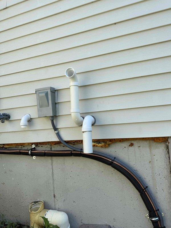 Completed installation of 3-ton air conditioning system with evaporator coil on right side of residence. Installed exterior condensing unit with proper refrigerant line connections, electrical disconnect, and conduit runs secured to building exterior. Interior work included evaporator coil installation with PVC condensate drain line routed to floor drain, electrical reconnection, and system startup. All mechanical and electrical permits obtained prior to installation, system tested and operating within manufacturer specifications.