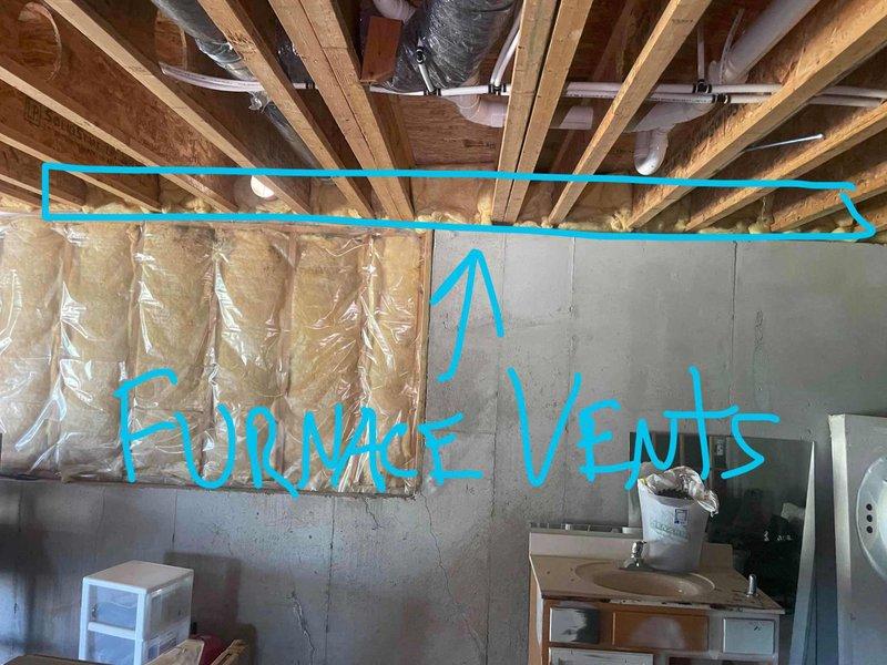 Provided estimate for complete whole home comfort package replacement including furnace and air conditioning system. Existing 16+ year old Carrier furnace and AC system currently operational but nearing end of service life. Equipment located in basement utility room with natural gas fuel source, existing ductwork and venting infrastructure in place for replacement installation.