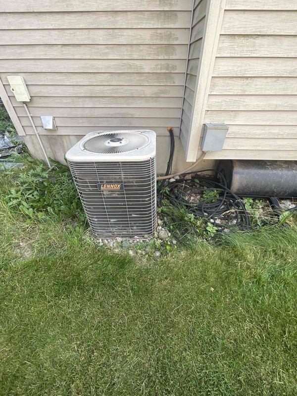 Provided comprehensive estimate for replacement of 31-year-old Lennox furnace and air conditioning system currently located in basement with outdoor condenser unit positioned on exterior side yard. Existing equipment remains operational but has exceeded typical service life expectancy, warranting full system replacement evaluation including updated efficiency options, proper sizing calculations, and installation requirements for both heating and cooling components.