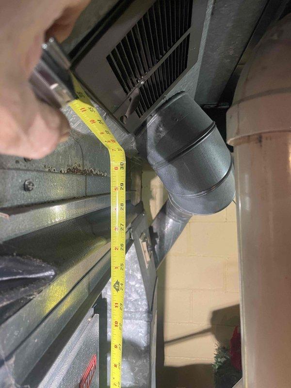 Responded to follow-up service call for iced-over air conditioning system initially discovered during routine maintenance appointment. Upon return visit, performed measurements and assessment of existing HVAC equipment and ductwork configuration to provide replacement estimate for the air conditioning unit.