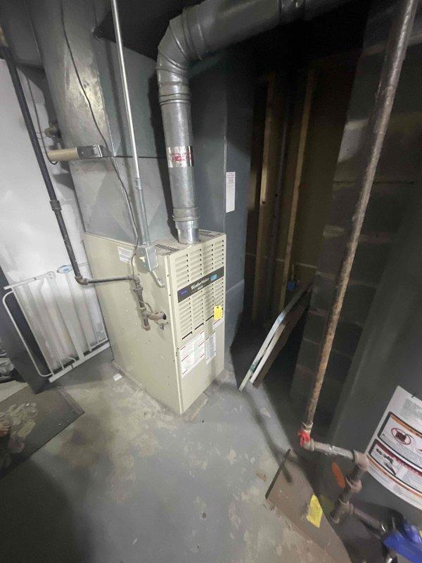 Completed site assessment for future central air conditioning installation in home without existing AC system. Evaluated basement mechanical room containing gas furnace with existing ductwork infrastructure, electrical service panel with adequate capacity for AC addition, and available space for condensing unit placement. Documented current HVAC configuration, electrical panel breaker availability, and utility routing to determine equipment specifications and installation requirements for planned spring 2027 installation.