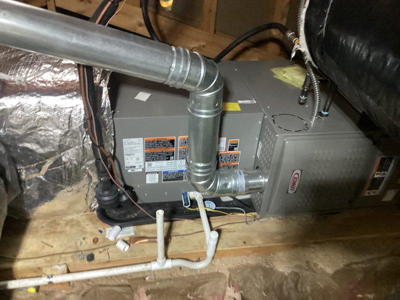 Completed full HVAC system installation in attic space, including 70,000 BTU furnace and 2.5-ton air conditioning unit with right-side configuration. Installed air handler on wooden platform with proper support structure, connected metallic ductwork with insulated flex duct, ran black electrical wiring to unit, and installed white PVC condensate drain lines in U-trap configuration. Reconnected all electrical and mechanical connections, ensured proper clearances around equipment, and secured all components per manufacturer specifications. Mechanical and electrical permits requested for installation. Note: Furnace requires dedicated electrical circuit to meet code compliance.